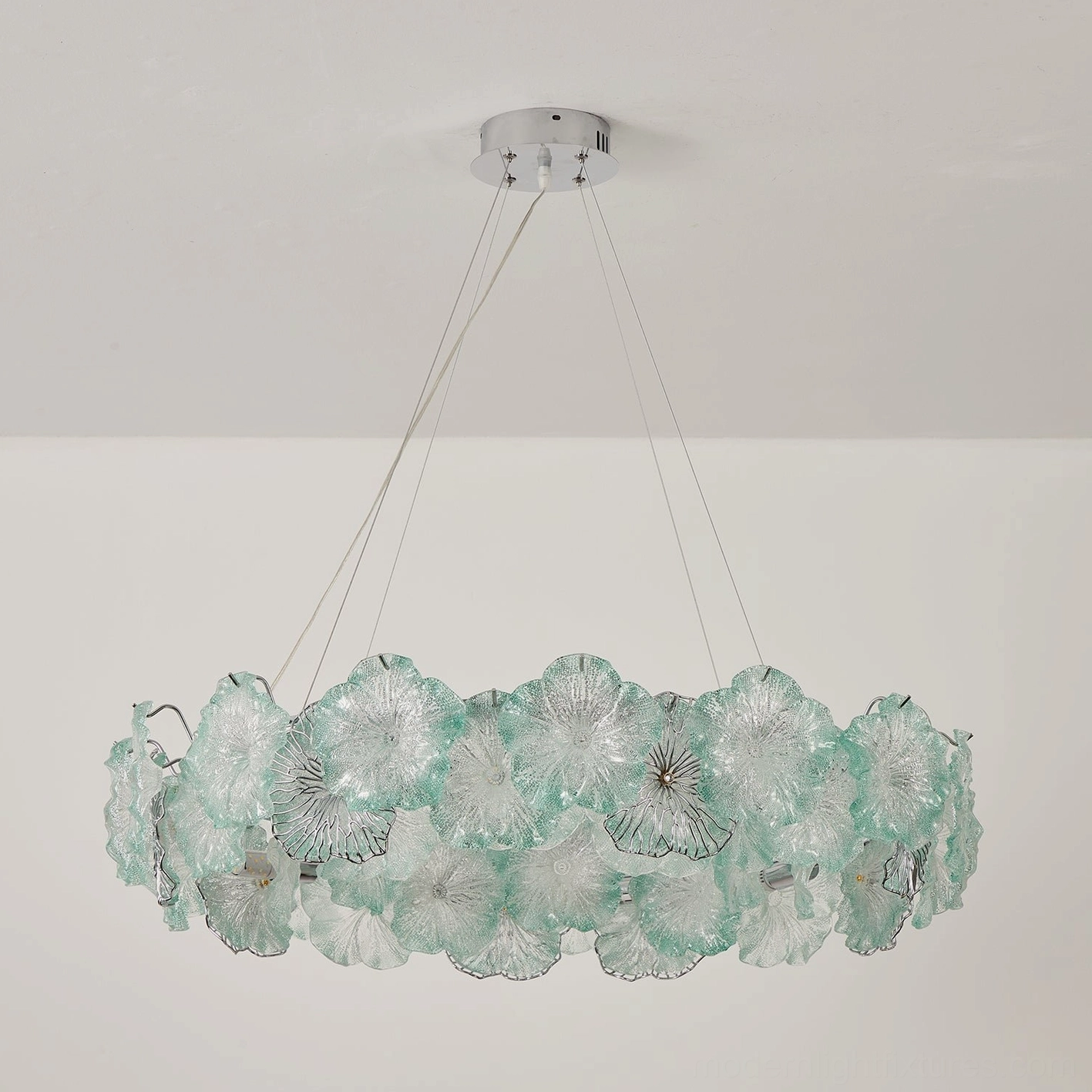 Celadine round two-tier chandelier in blush pink with hand-formed glass blossoms, grand room installation showing dimensional height