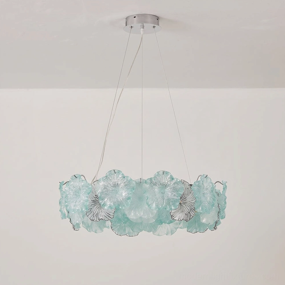 Celadine single-tier round chandelier with hand-formed glass blossoms demonstrating foyer installation above console table