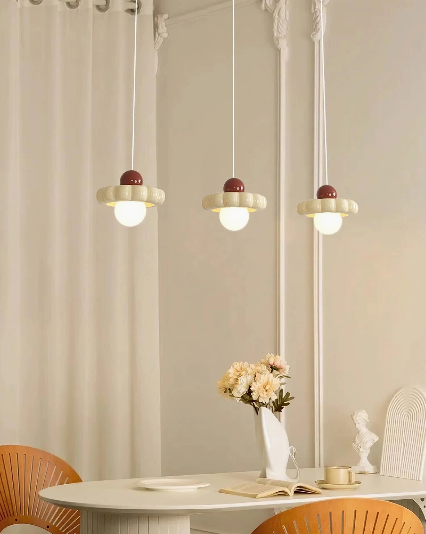 Triple Celena cloud pendant lights above round dining table, minimalist warm home decor