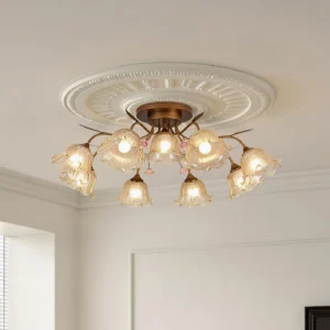 Celestia floral ceiling fixture mounted on decorative ceiling medallion with warm glowing amber glass petals