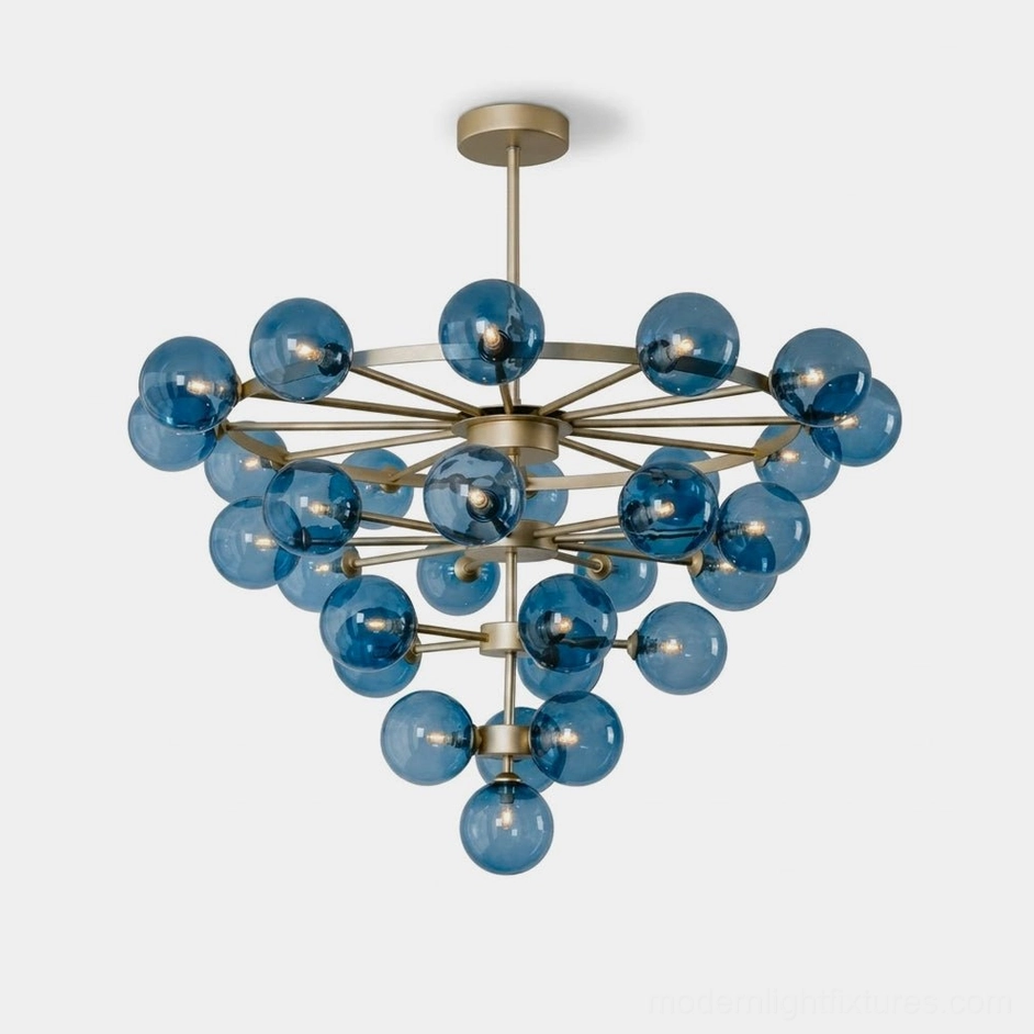 Celestine tiered bubble chandelier front view with 30 blue glass globes and brass-tone frame, studio lighting