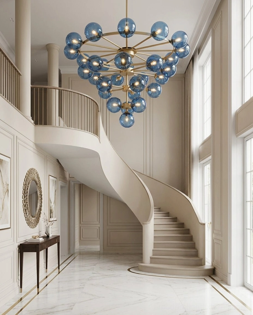Celestine bubble chandelier in double-height luxury foyer with grand staircase and elegant traditional-modern architecture
