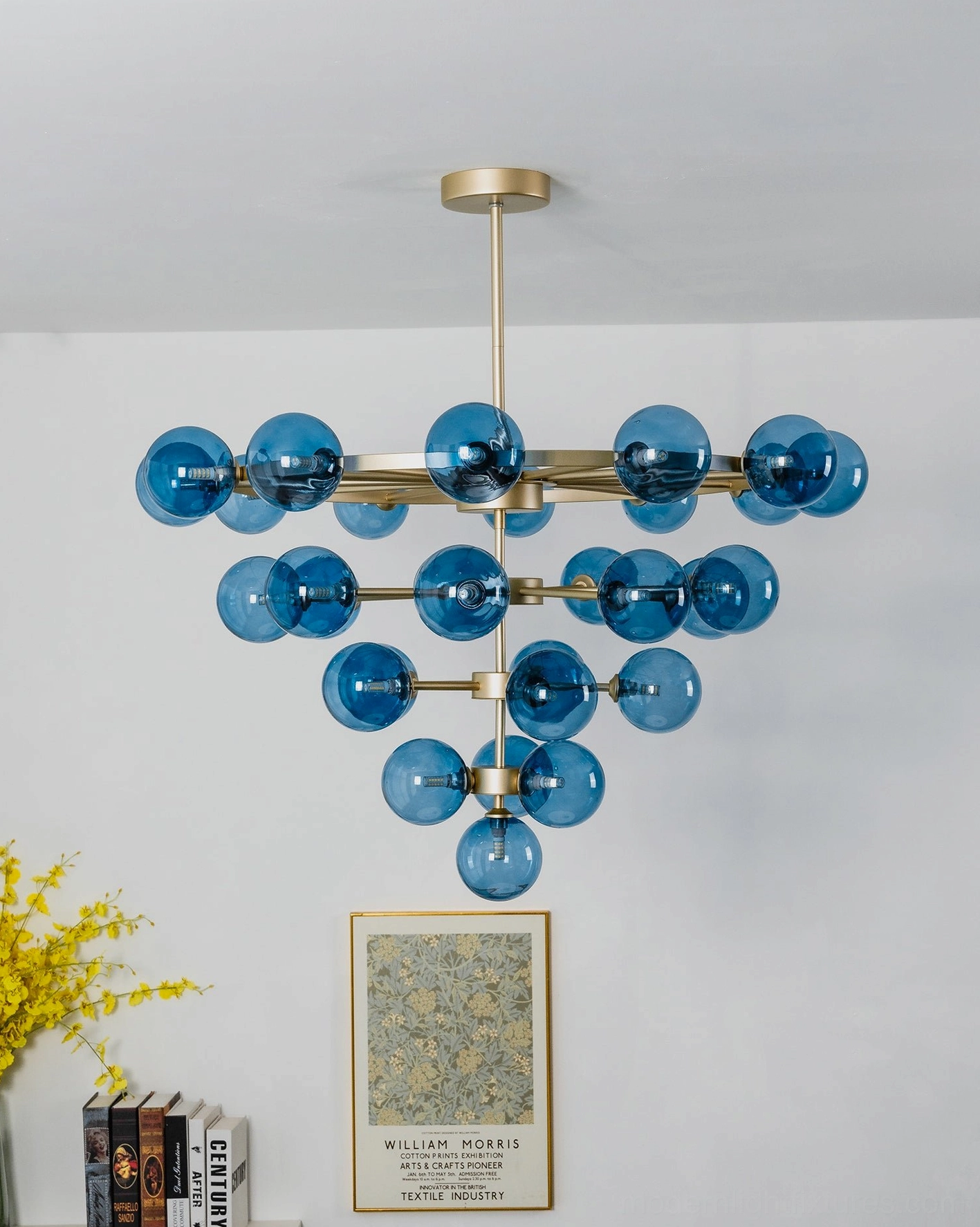Celestine tiered bubble chandelier scale reference in room showing substantial presence and high-ceiling fixture proportions