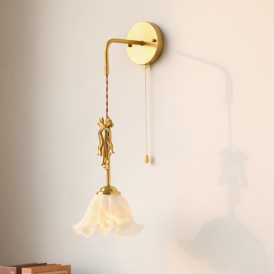 Celestine vintage wall sconce with ruffled frosted ceramic shade and decorative brass bow detail