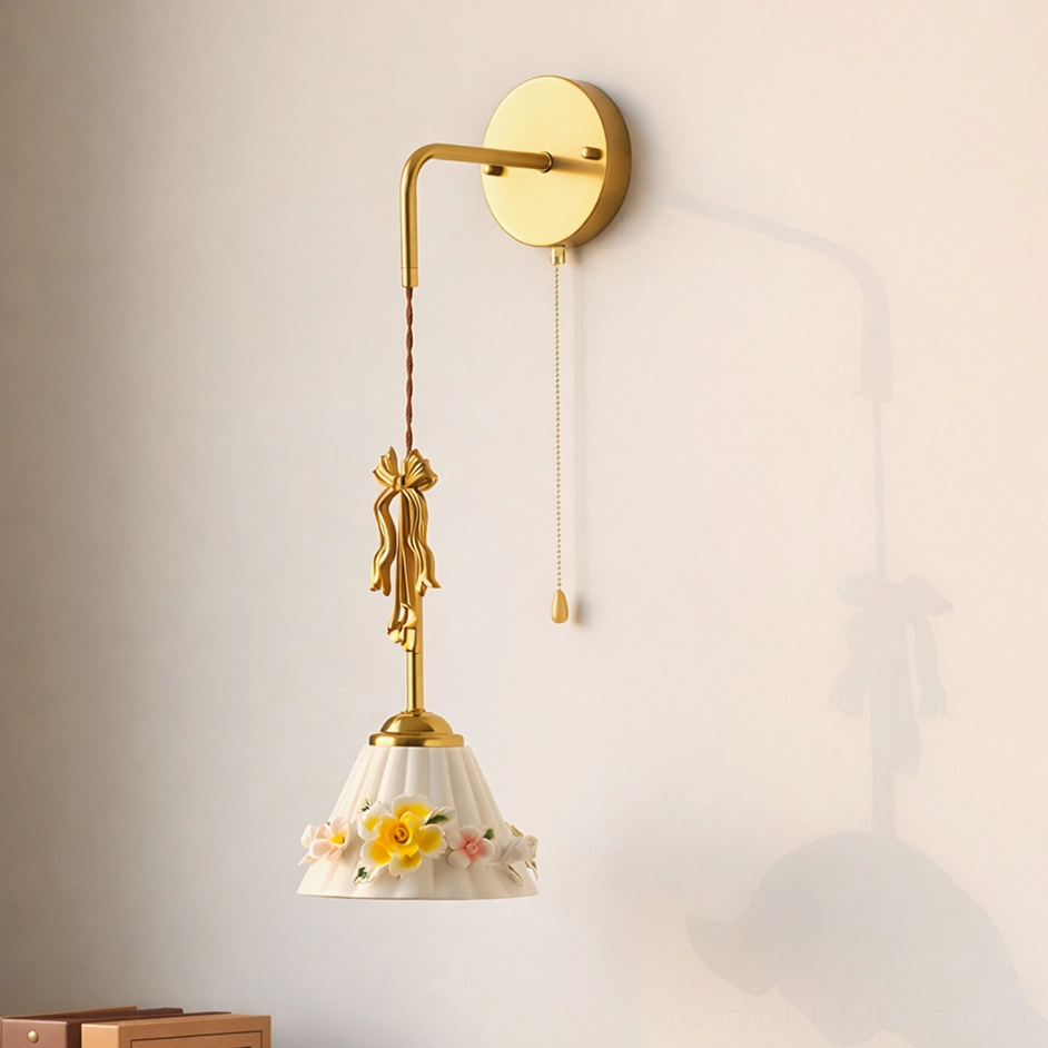 Celestine vintage wall lamp with yellow flower ceramic shade, brass finish, and pull chain mechanism