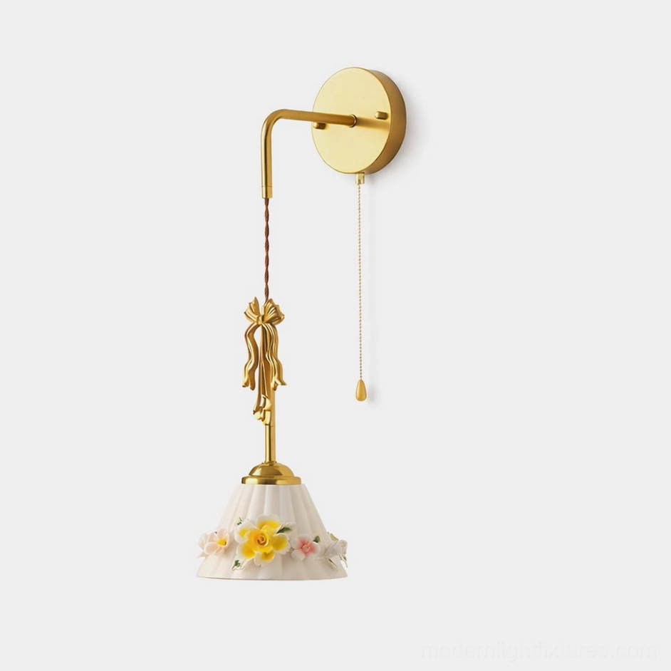 Celestine vintage wall sconce with hand-painted floral ceramic shade and brass gold finish, front studio view