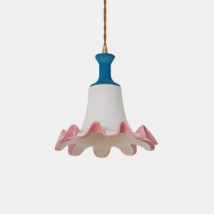 Celina ceramic pendant light with blue crown and pink ruffled edge displayed against minimalist white backdrop, showcasing sculptural bell-shaped design