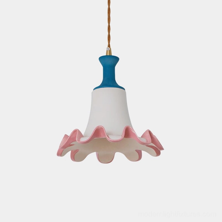 Celina ceramic pendant light with blue crown and pink ruffled edge displayed against minimalist white backdrop, showcasing sculptural bell-shaped design