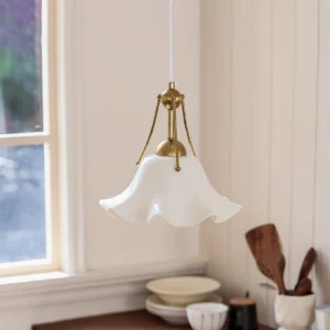 Celisse ceramic pendant light warm brass hardware detail close-up