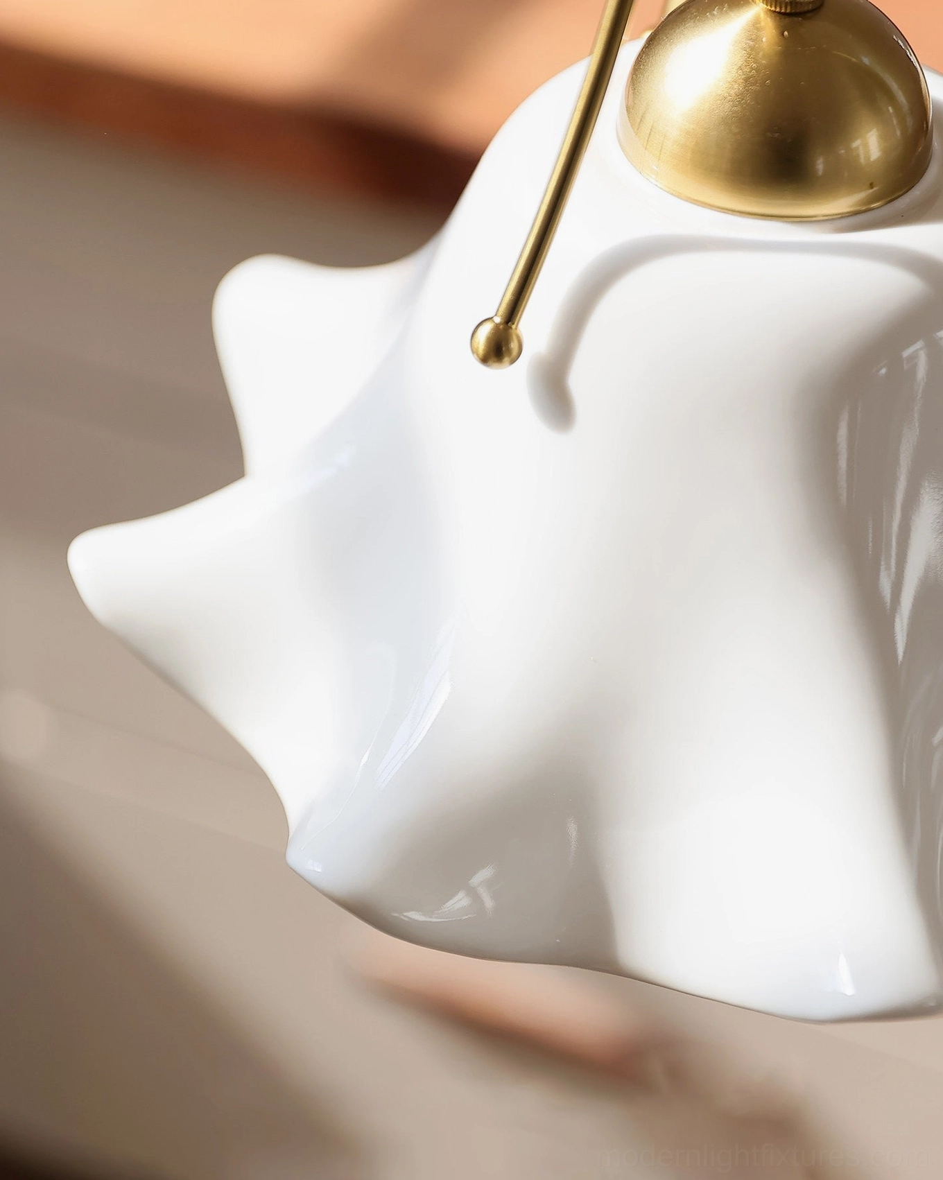 Celisse porcelain pendant light three-prong metal yoke sphere finial