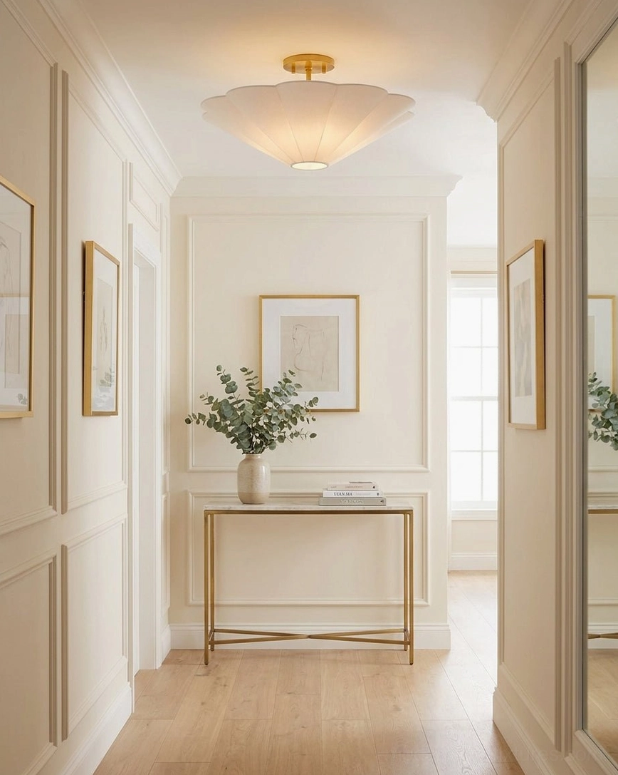 Celora semi-flush ceiling light mounted in residential hallway corridor with paneled wall trim and minimalist console styling