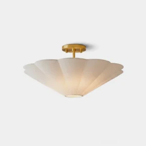Celora semi-flush mount ceiling light with scalloped cream fabric shade and warm gold-finish metal canopy, front view on white studio background