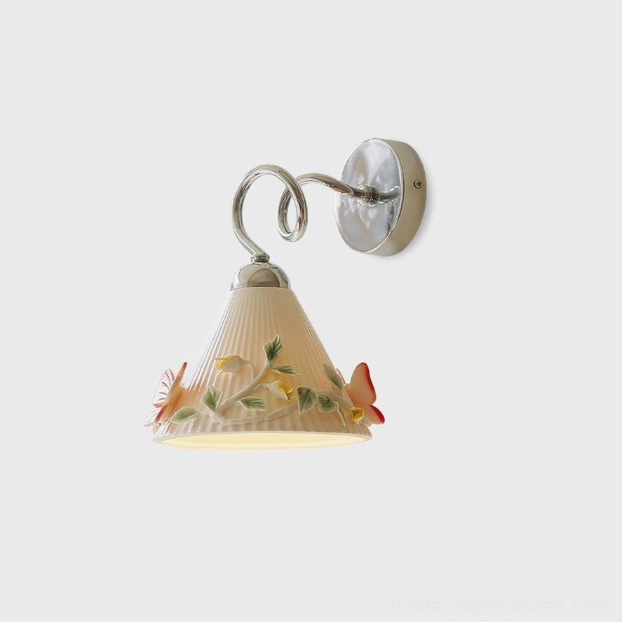 Florynna hand-painted ceramic butterfly wall sconce with polished chrome curved arm, front studio view showing ribbed shade with embossed floral details