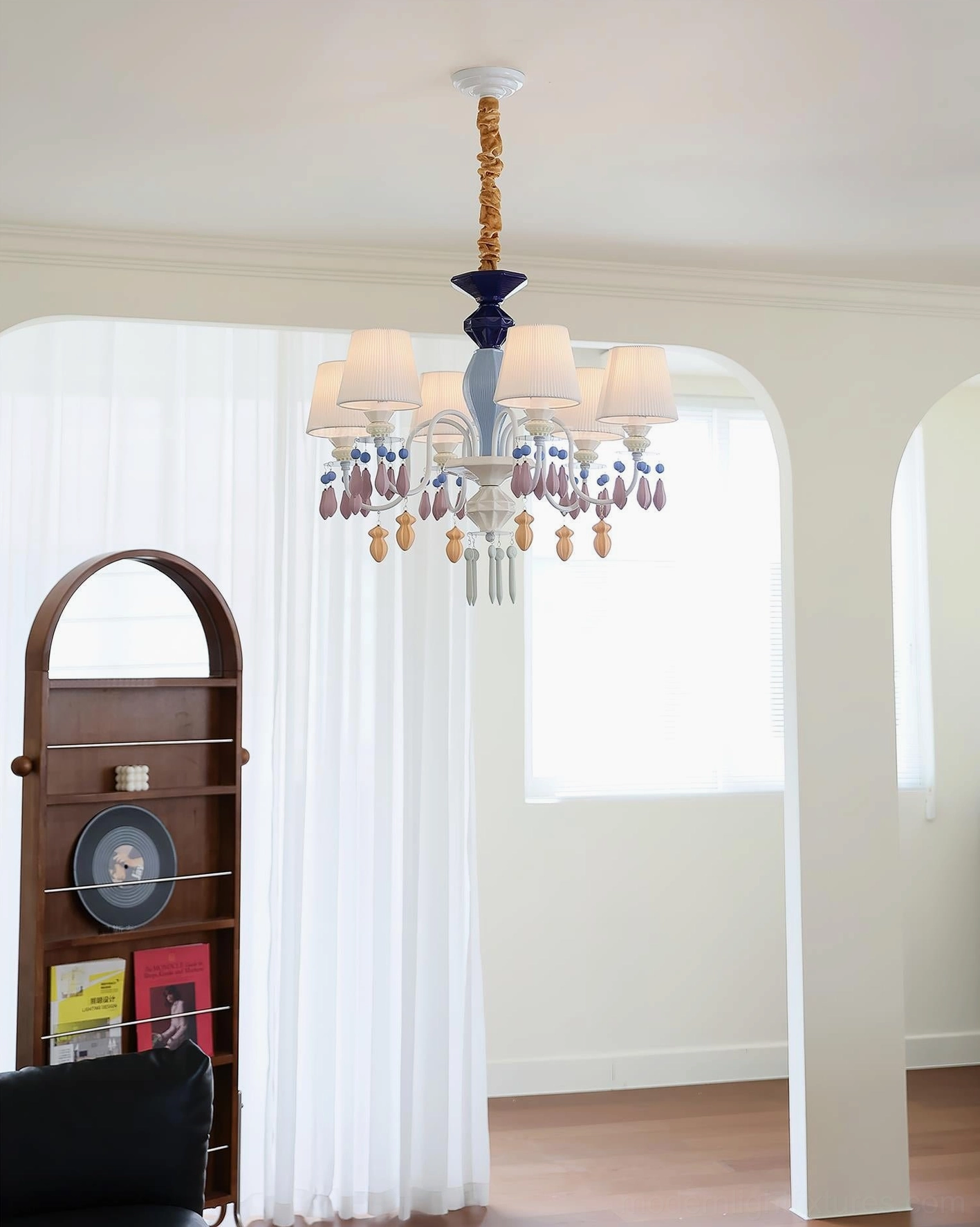 Close-up detail of ceramic chandelier showing decorative crystal pendants and sculptural bead work