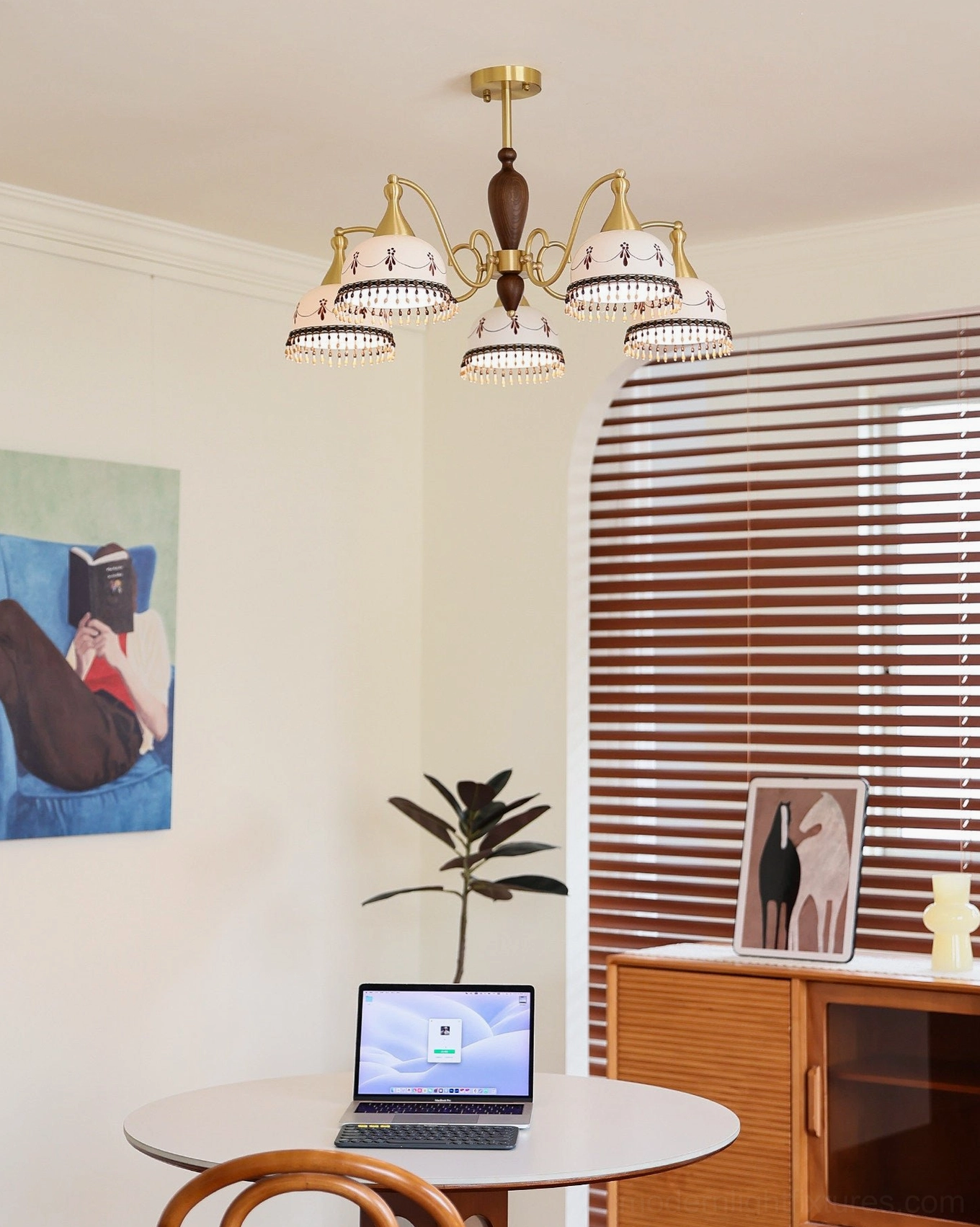 Five-light hand-painted ceramic chandelier configuration in warm interior setting