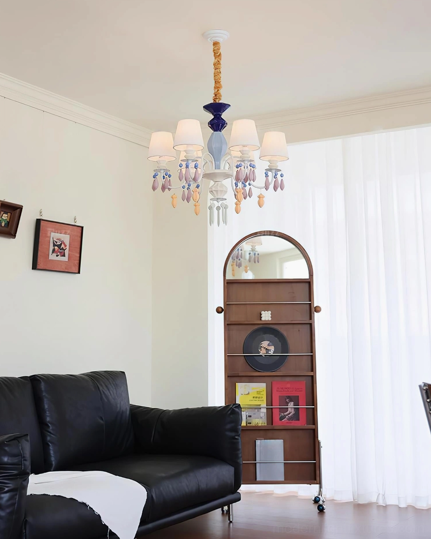 Perspective view of ceramic chandelier highlighting the interplay of light and decorative crystal pendants