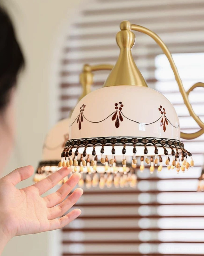 Hand-painted ceramic bell shade with decorative beading - close-up detail view