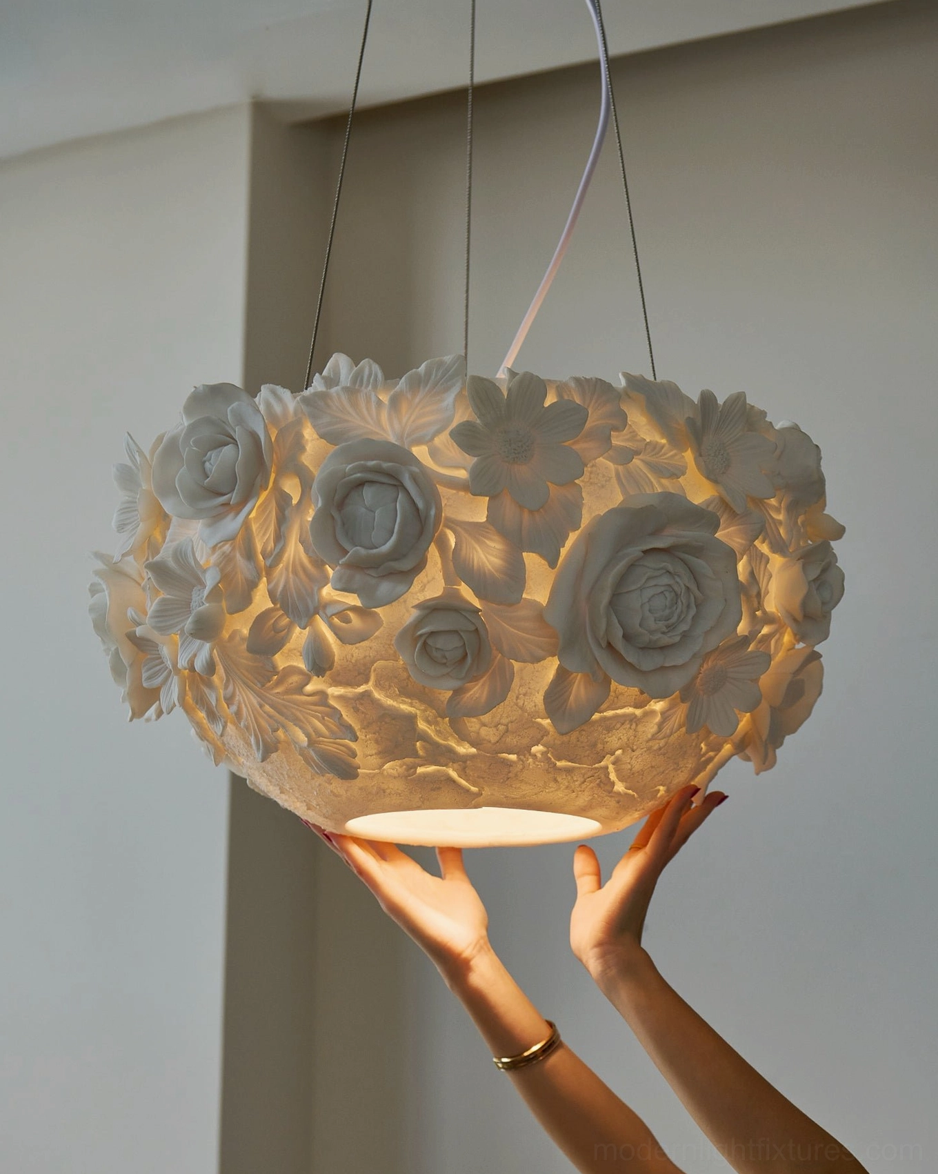 Close-up detailed view of ceramic floral pendant light showing intricate 3D flower petals and leaf textures at eye level