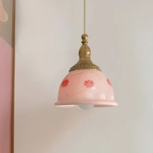 Ceramic floral pendant lamp side angle view showing intricate hand-painted red flower patterns on pink shade