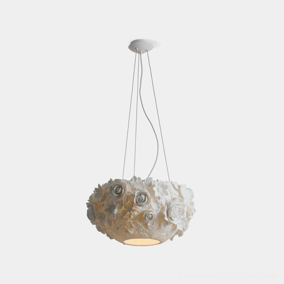 Handcrafted ceramic floral pendant light with sculptural white flowers and leaves, studio overhead view showing dimensional petal details