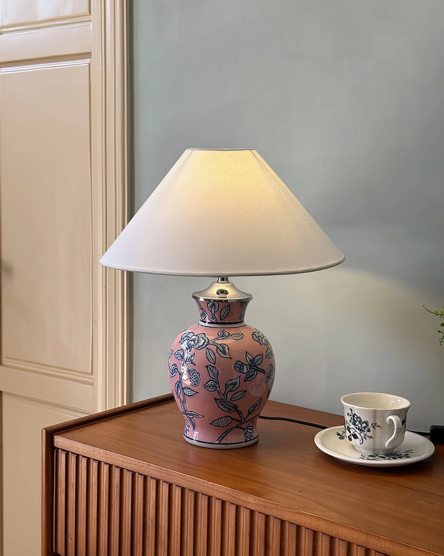 Ceramic botanical table lamp collection showing multiple color variants and fabric shade design details