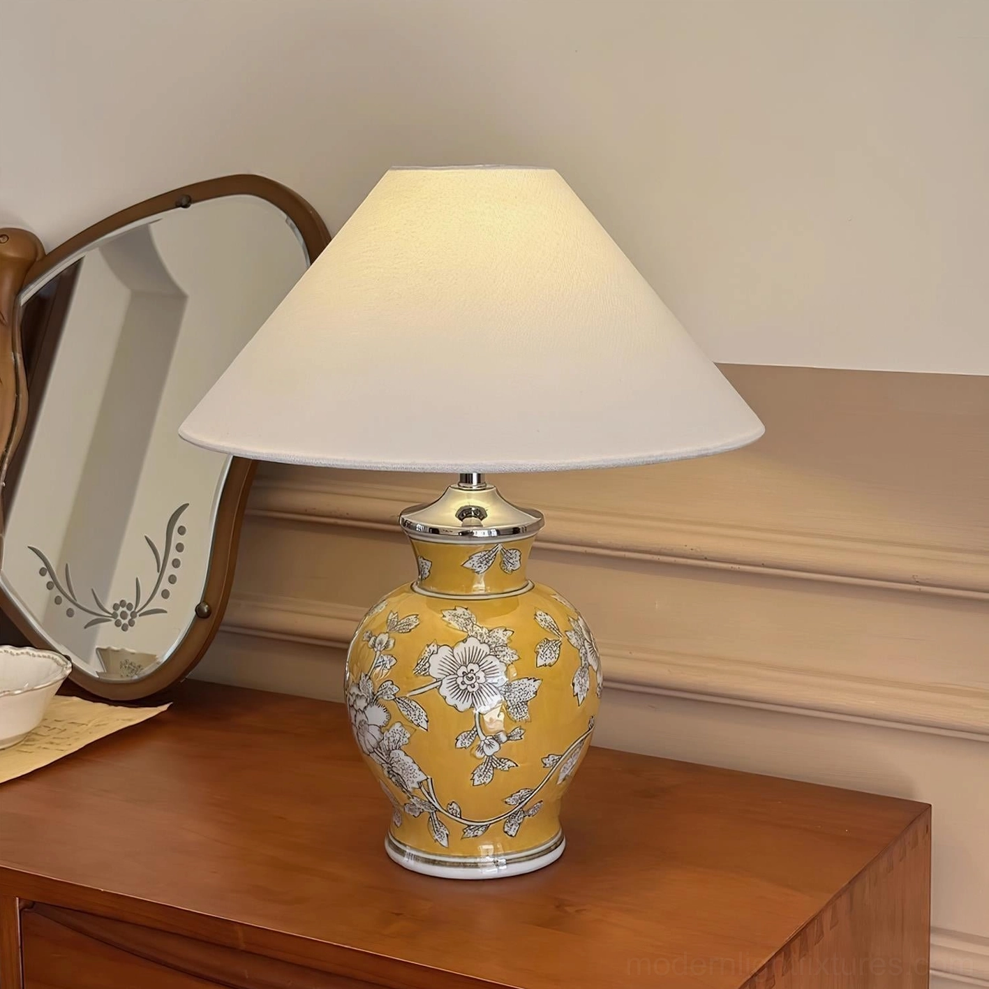 Ceramic botanical table lamp showing glaze finish detail and hand-applied floral decoration craftsmanship