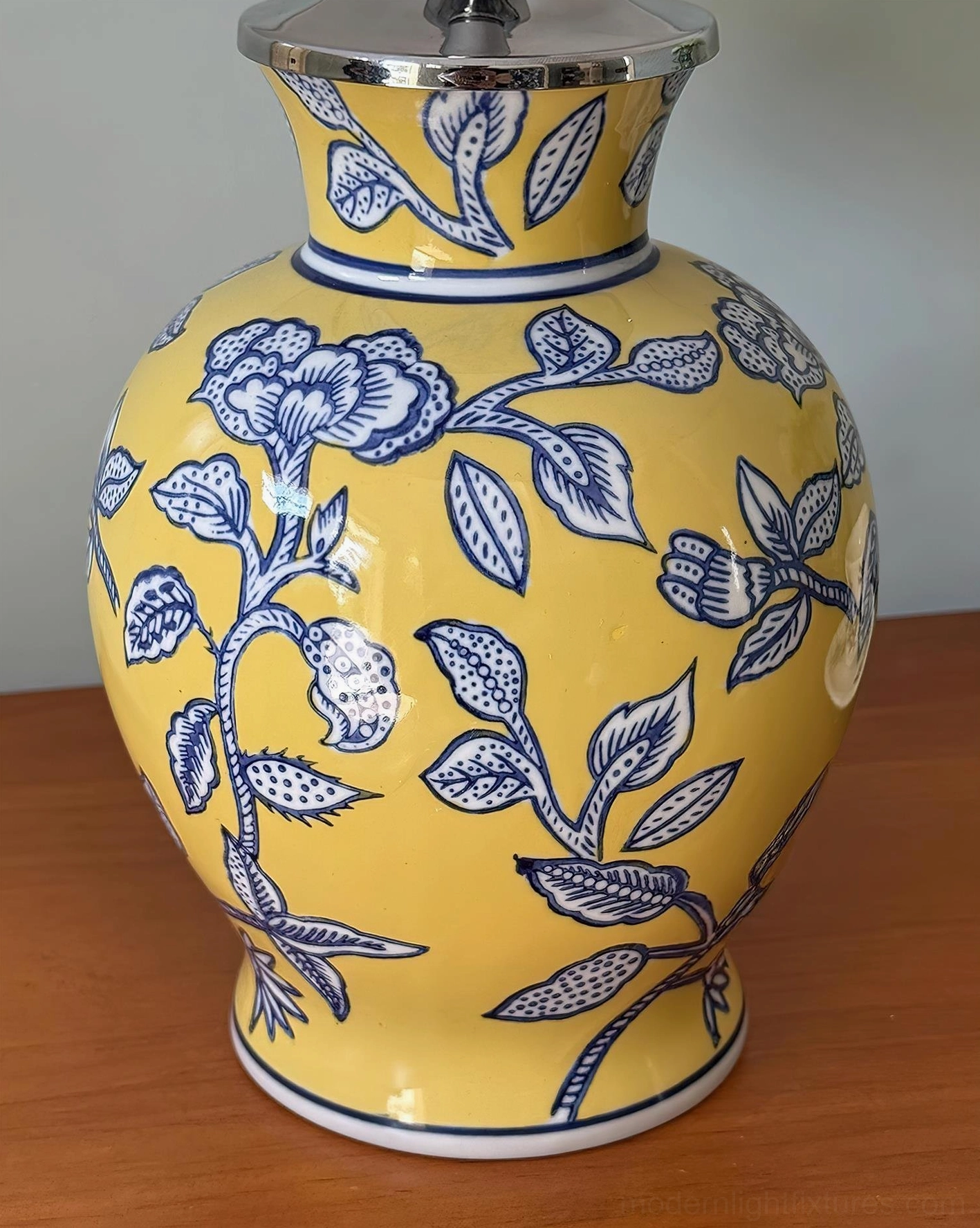 Ceramic floral table lamp with handcrafted ceramic base and fabric shade, transitional home interior design