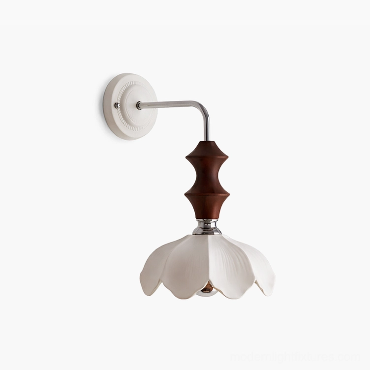 Ceramic floral wall sconce with white petaled shade and walnut wood detail - angled studio perspective