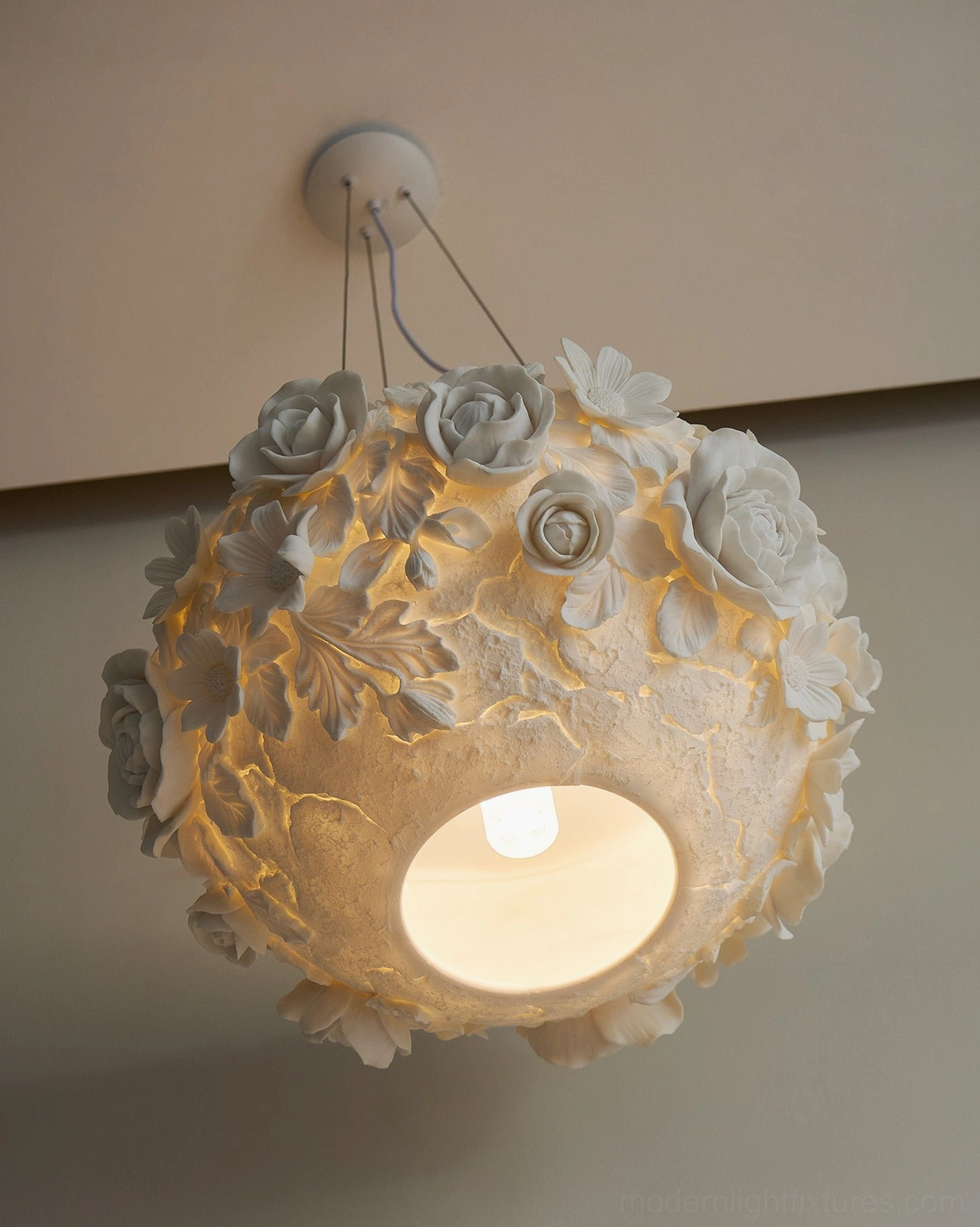 Handcrafted ceramic flower bouquet pendant light with dimensional petal arrangement, soft warm illumination effect