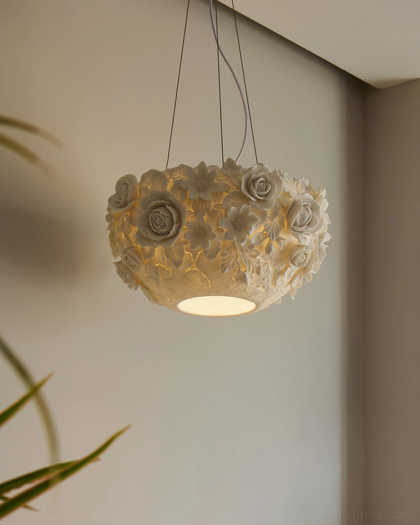 Ceramic flower pendant lamp suspended above, showing full sculptural form with off-white finish and dimensional details
