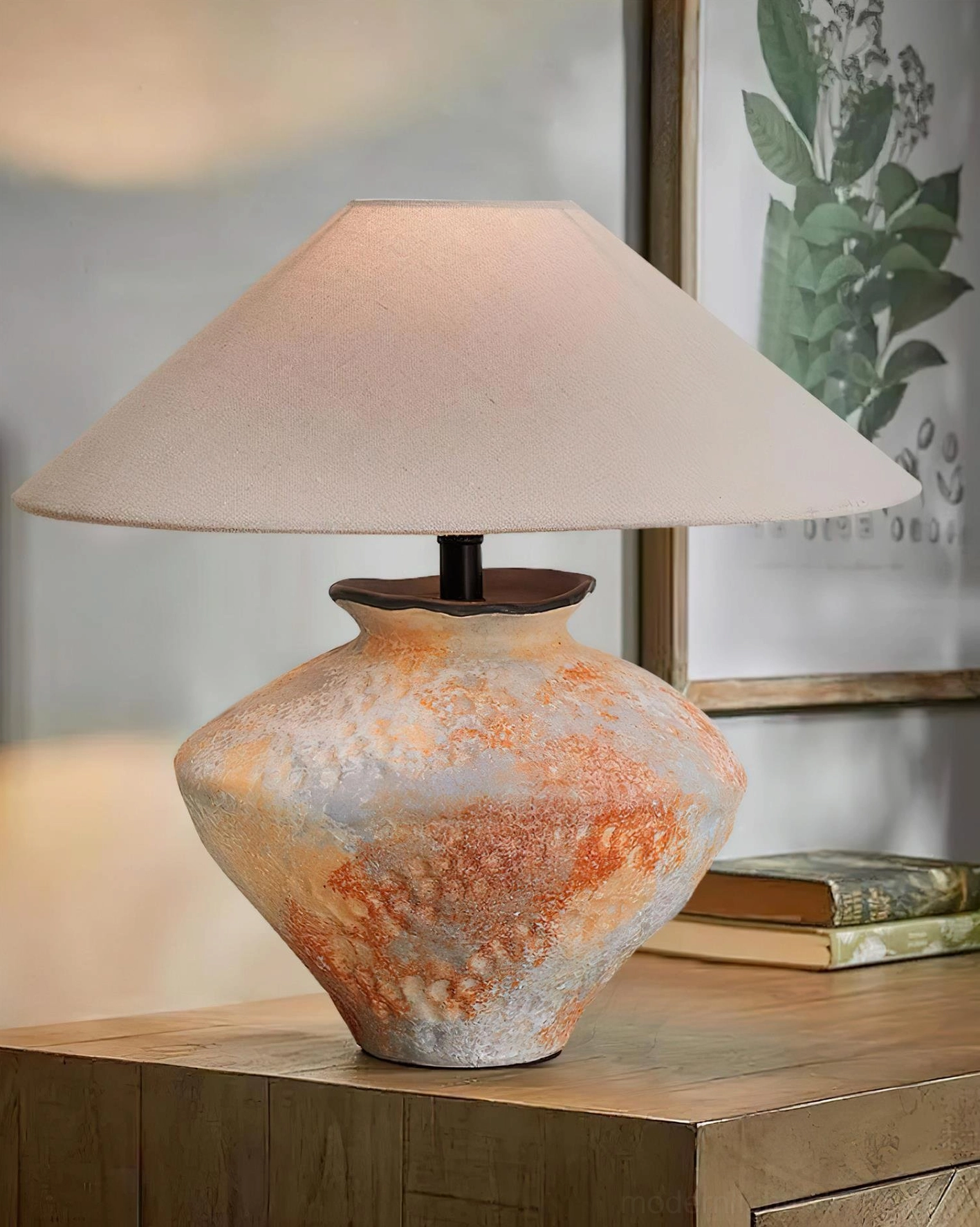 Ceramic table lamp bedroom bedside setting with wall art stacked books rustic nightstand warm lighting