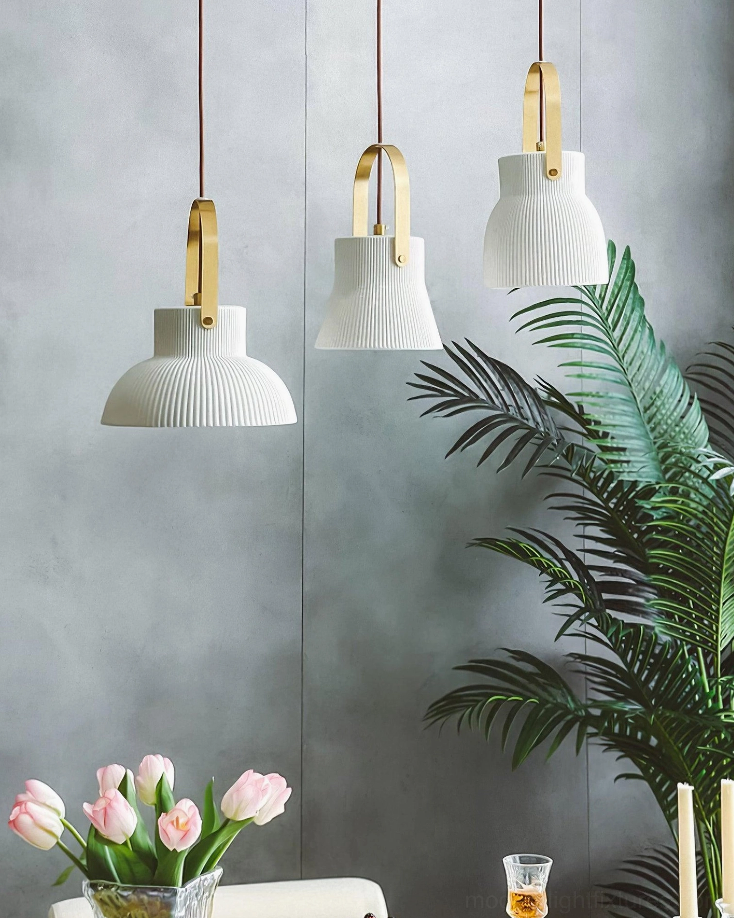 Ceramic pendant lamp with brass components in transitional modern design setting