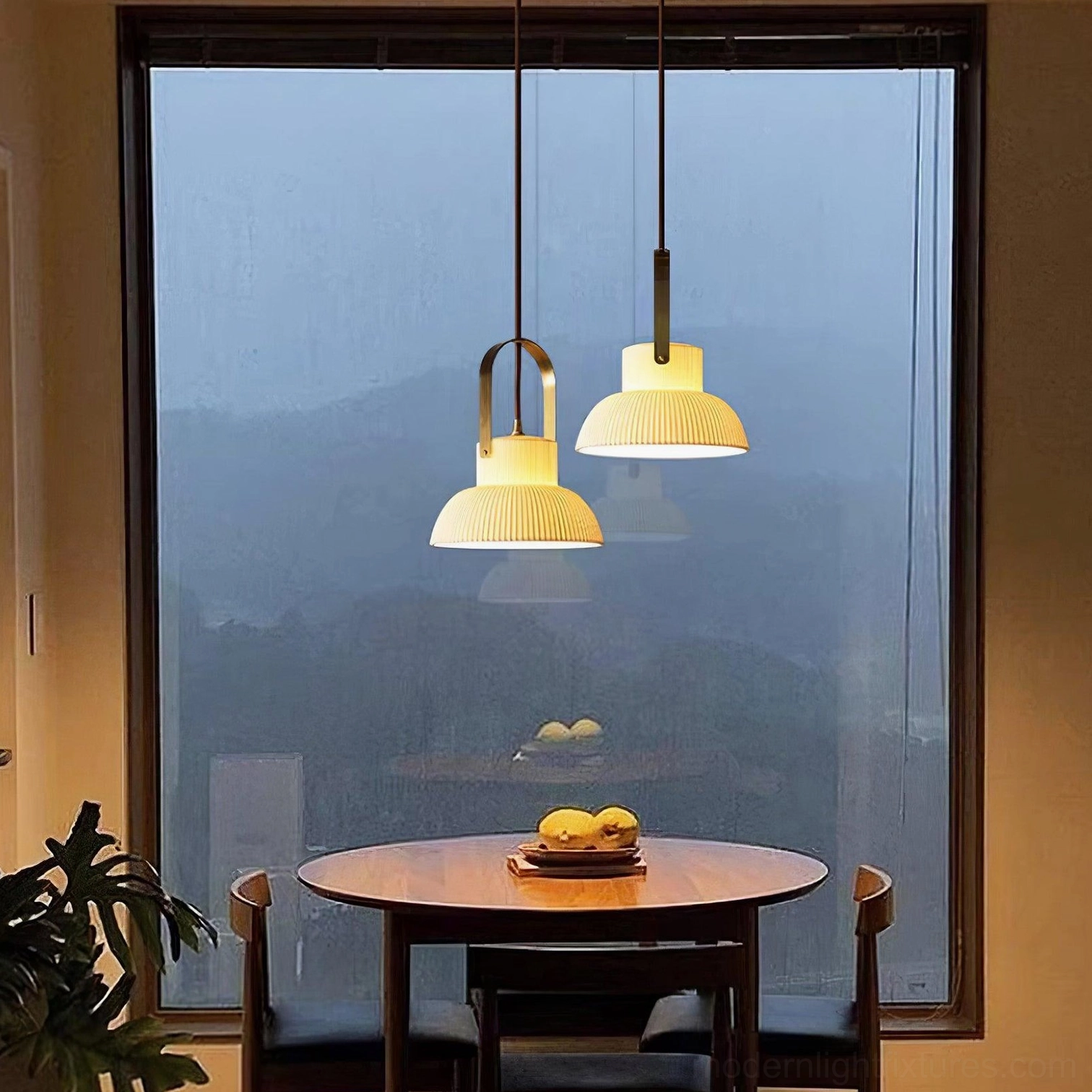 Modern ceramic pendant lamp with brass top fixture mounted in contemporary interior setting