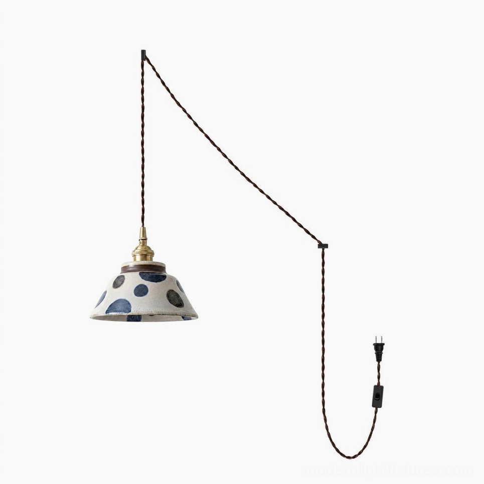Hand-glazed ceramic pendant lamp with all five pattern variants displayed together showing indigo design variations