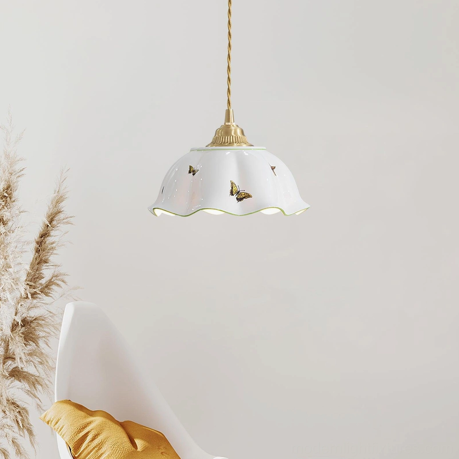 White ceramic butterfly pendant lamp in relaxing leisure corner with scalloped shade detail