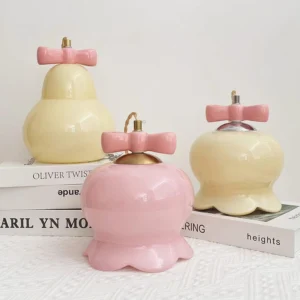Ceramic pendant lamp with scalloped base and glossy finish displayed on bookshelf