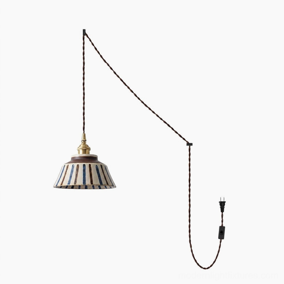 Plug-in ceramic pendant lamp cord and swag hooks installed showing adjustable hanging configuration in residential space