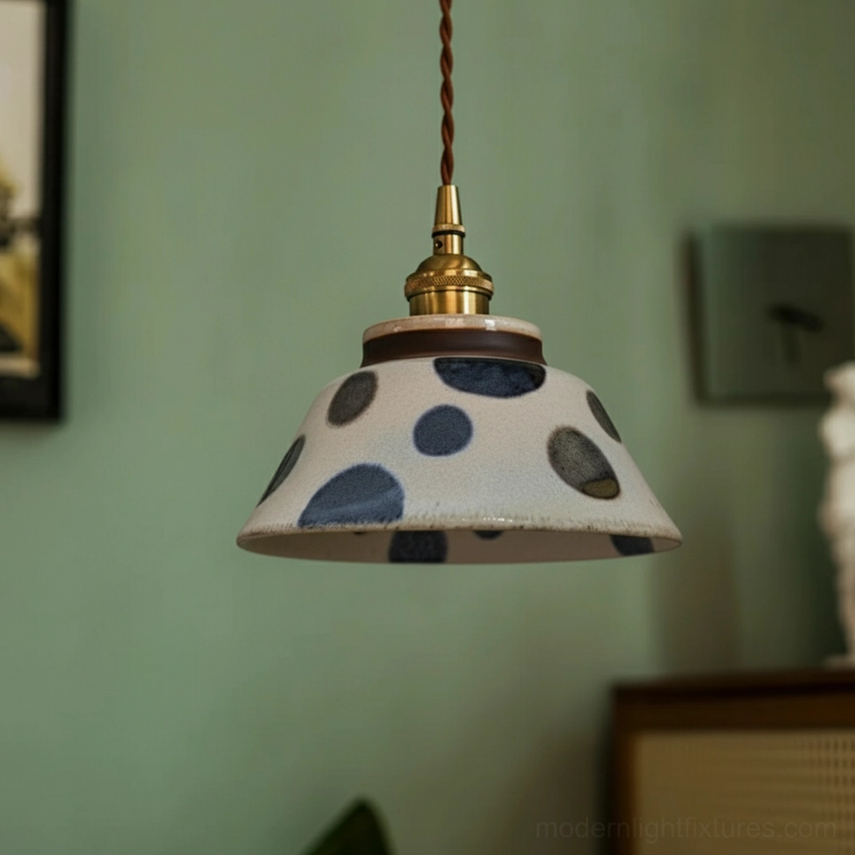 Artistic composition featuring ceramic pendant light as centerpiece with surrounding home decor