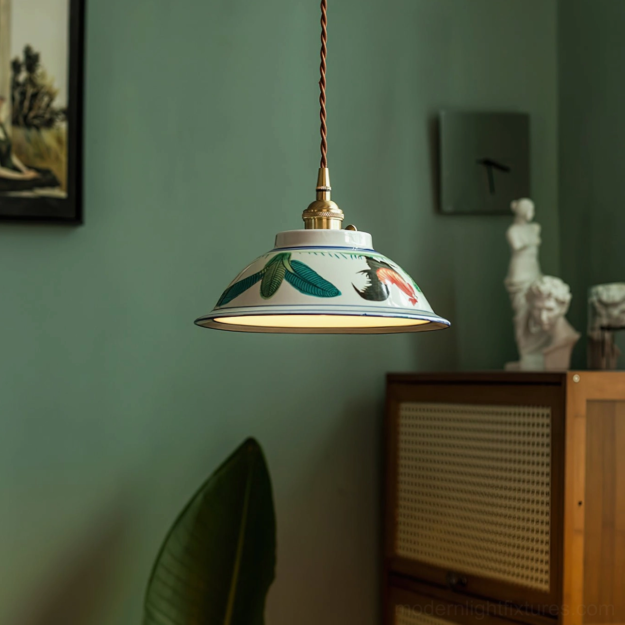 Ceramic pendant light with braided fabric cord and brass hardware in warm interior lighting, demonstrating poetic glow and ambiance