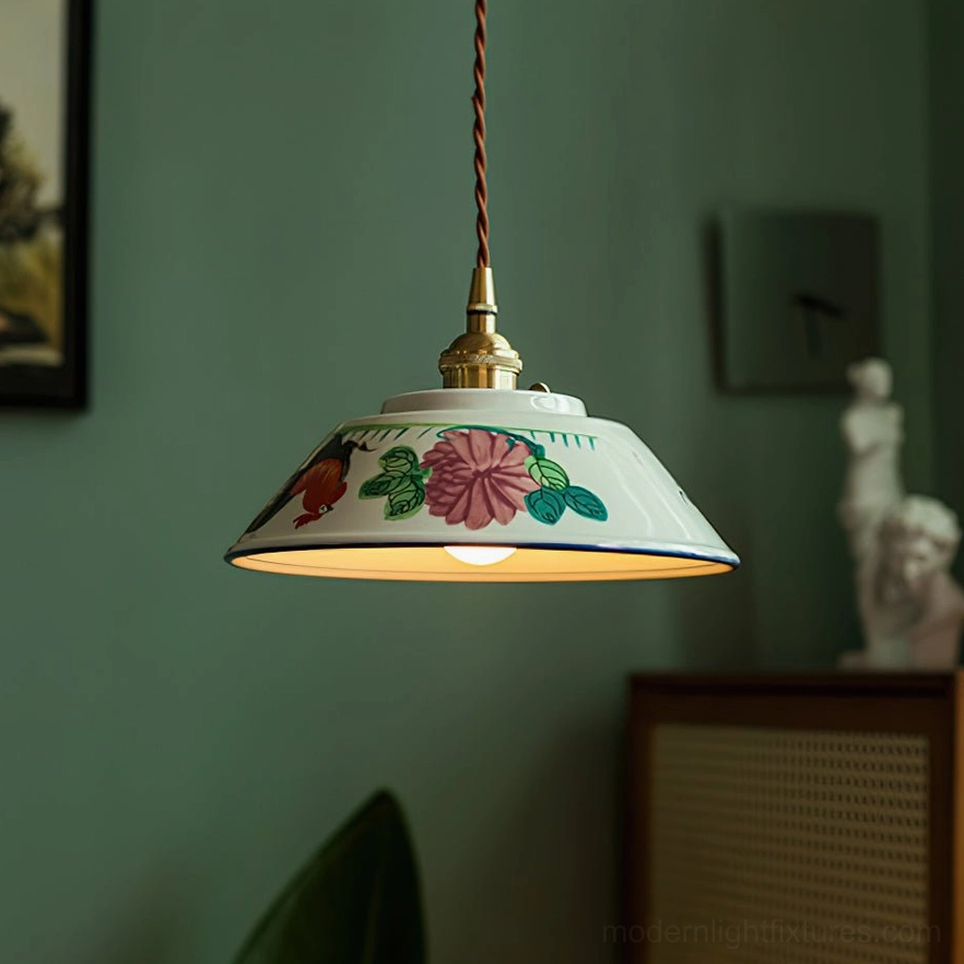 Ceramic pendant light with brass fittings and braided fabric cord in green and brass color combination, product lifestyle view