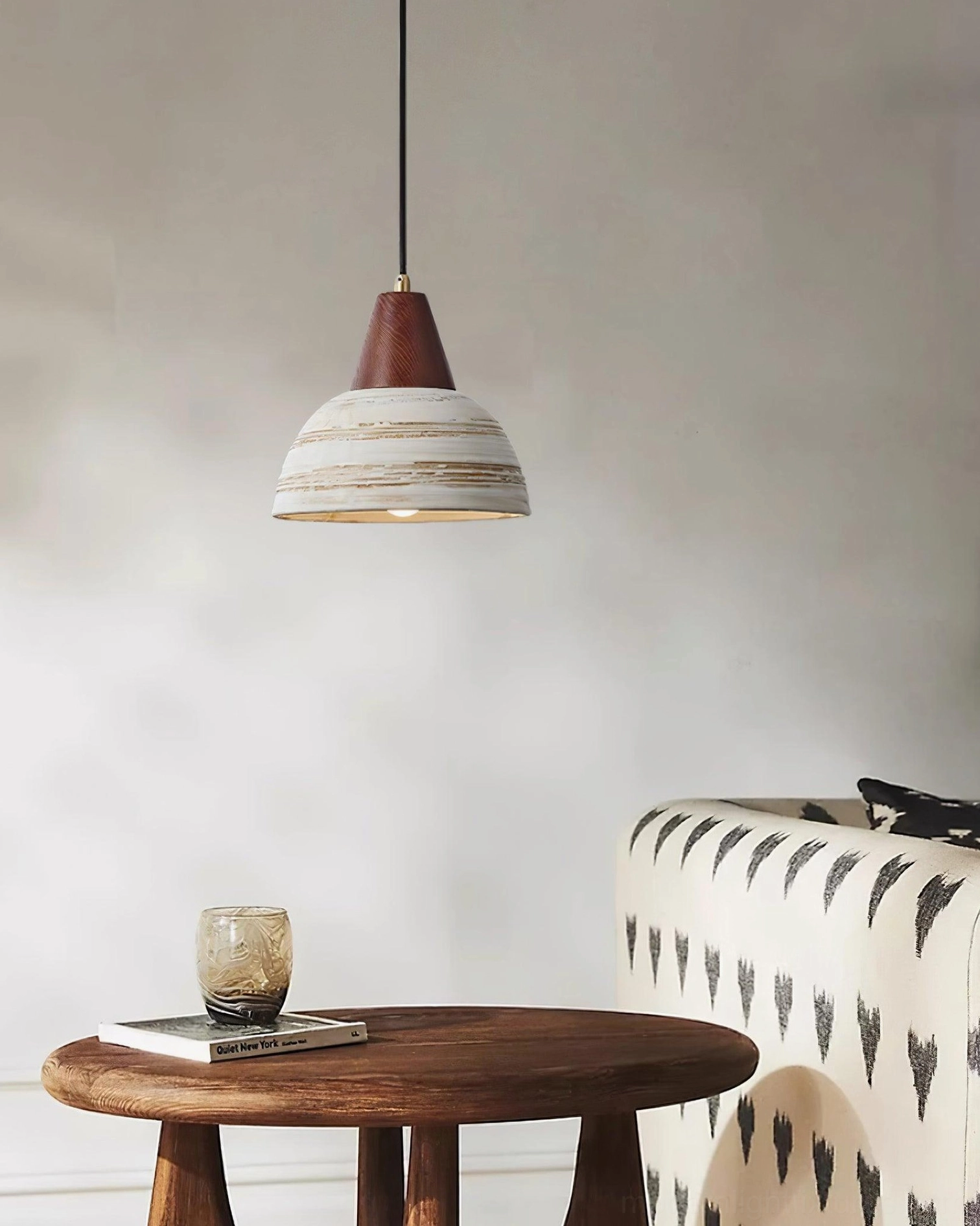 Handcrafted ceramic pendant light in contemporary interior setting - modern rustic ambiance