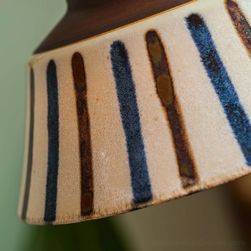 Overhead perspective of ceramic pendant light installation showing hanging angle and position