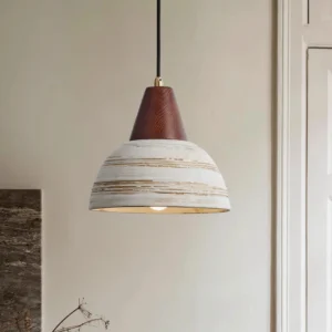 Modern ceramic pendant light illuminated in rustic home interior corner setting with warm neutral tones
