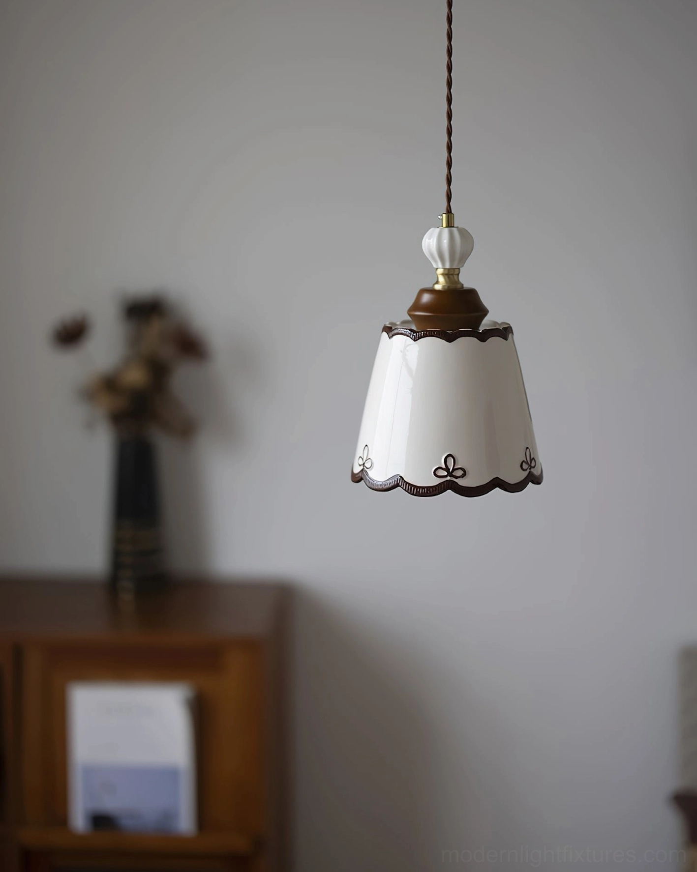 Ceramic pendant light with scalloped edges and bronze trim for vintage and cottage style home design