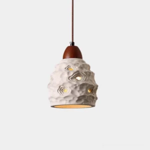 Organic ceramic pendant light with sculptural texture and perforated shade in off-white with walnut wood accent - frontal studio view