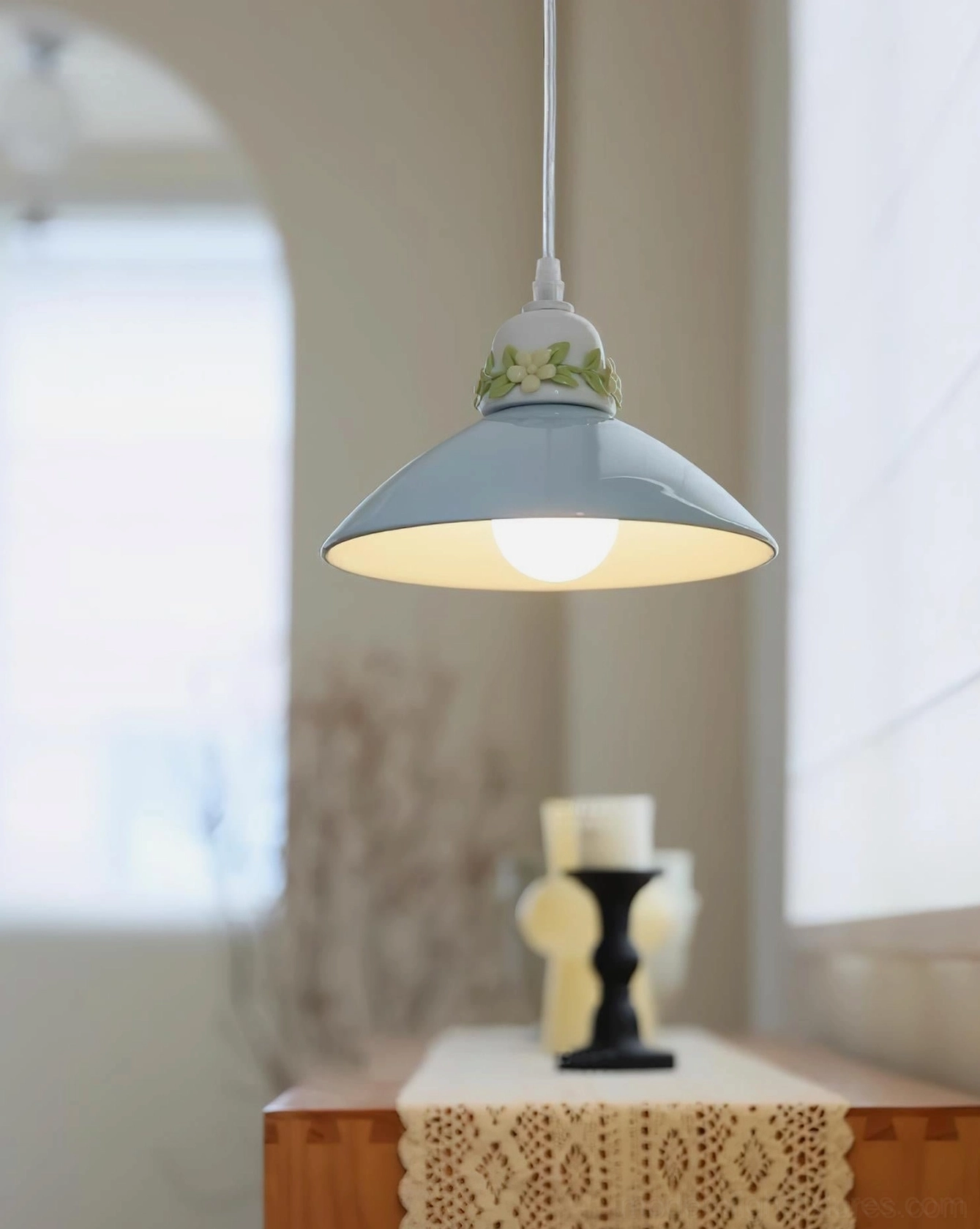 Hand-painted ceramic petal pendant light size and scale reference in home setting, hanging placement proportion demo
