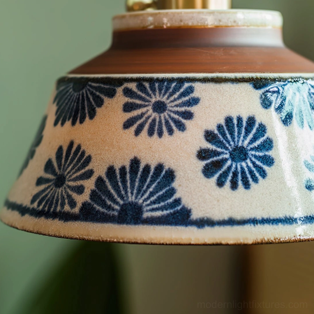 Decorative arrangement showing ceramic pendant light paired with table ceramics and vessels
