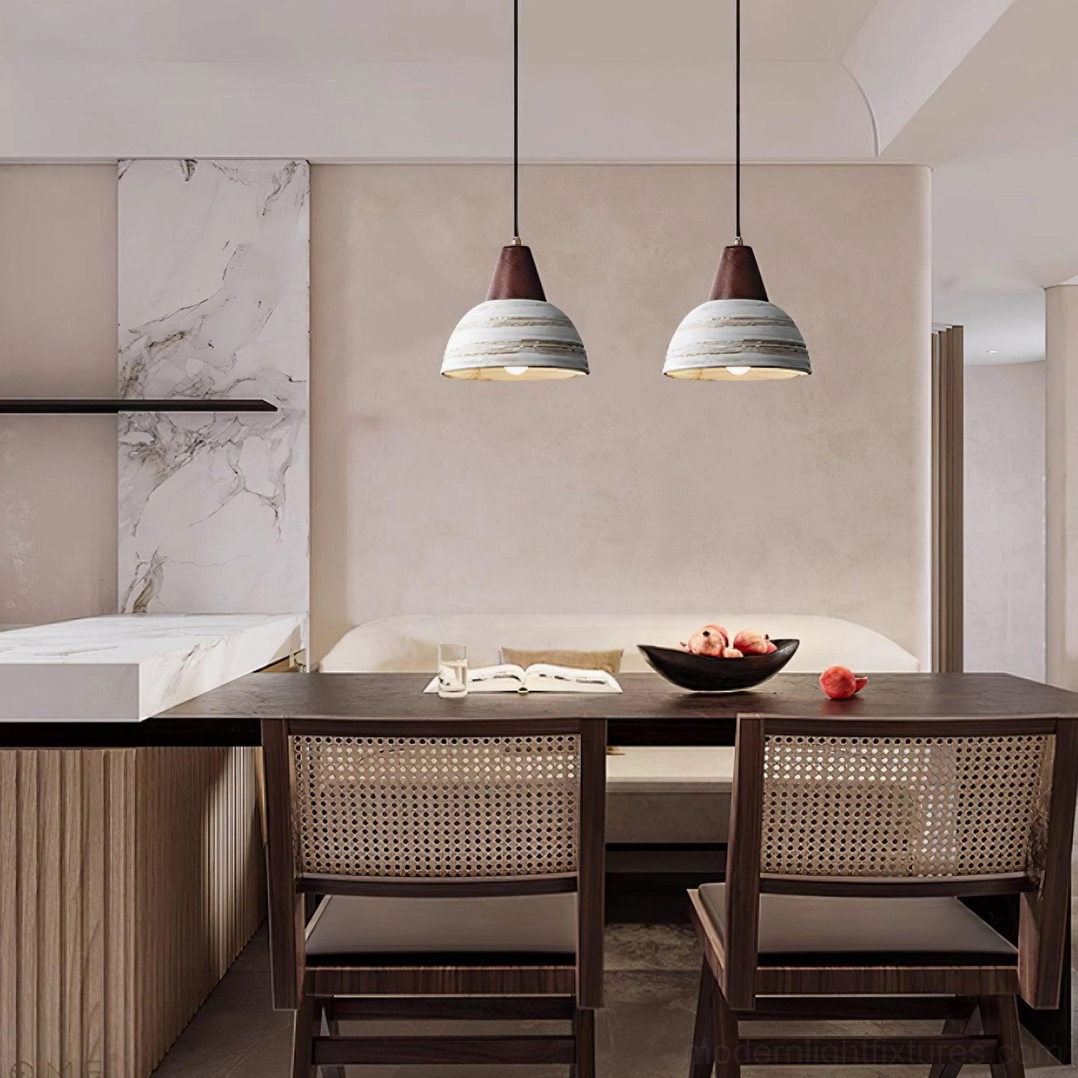 Pair of modern ceramic pendant lights hanging above dining table in contemporary rustic interior