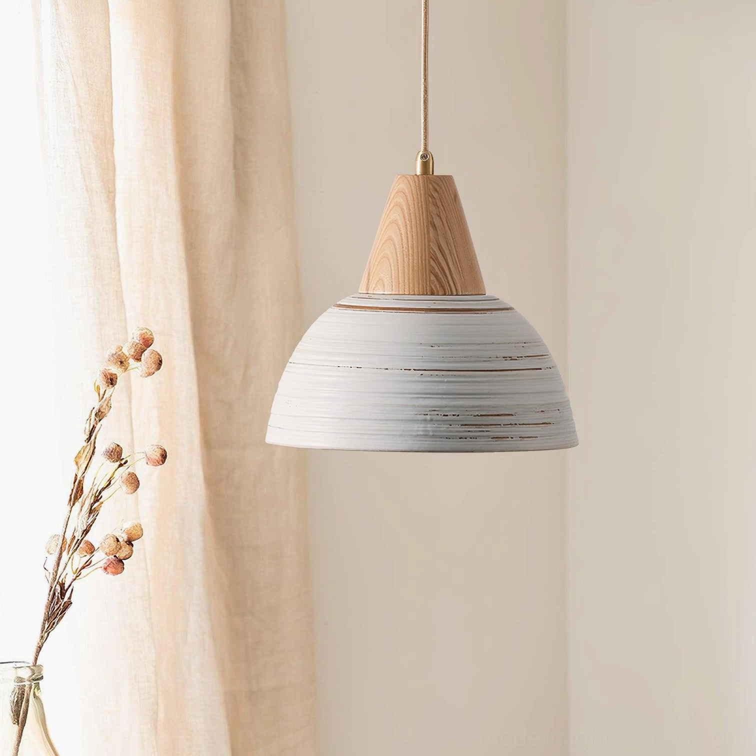 Pair of handcrafted ceramic pendant lights with wood tops in sunlit interior space - modern rustic dining setup