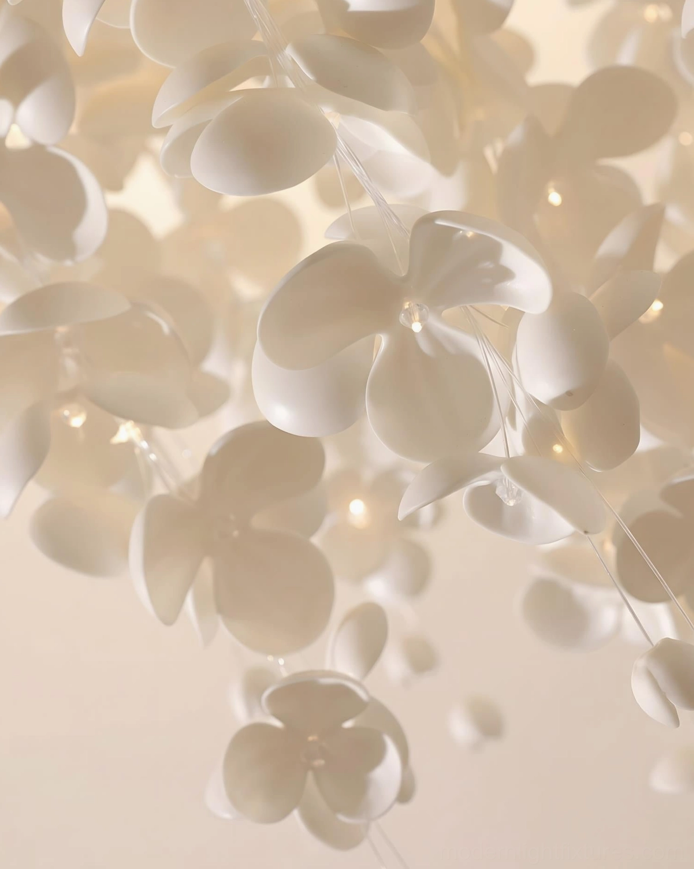 Close-up macro shot of white ceramic petal pendant details with matte finish and built-in tiny warm lights